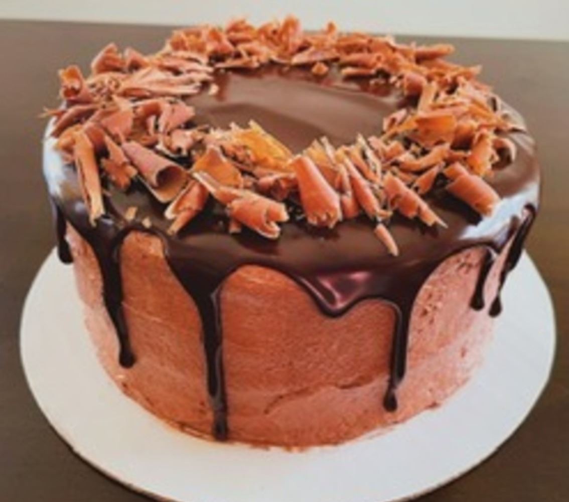 Deluxe chocolate layer cake with ganache and chocolate shavings